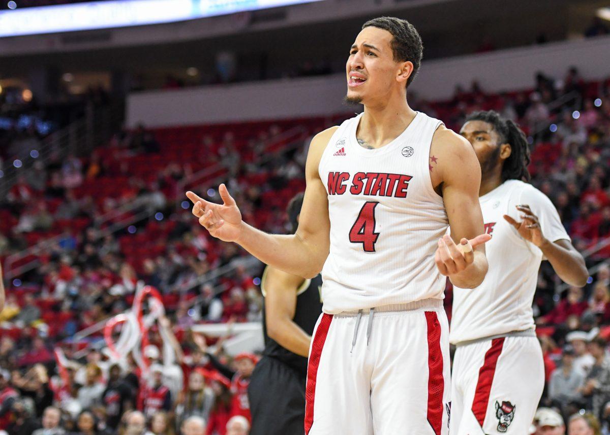 Senior forward Jericole Hellems questions a foul call against him during the game versus the Wake Forest Demon Deacons on Wednesday, Feb. 9, 2022 in PNC Arena. Hellems scored nine points and had three rebounds against the Demon Deacons. NC State lost to Wake Forest 69-51.