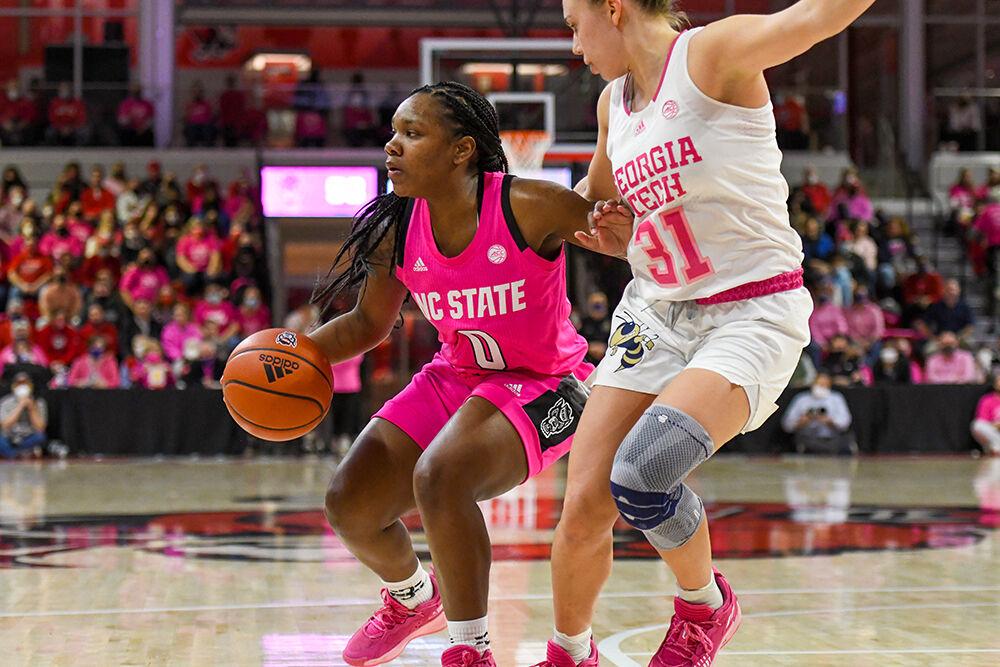 Sophomore guard Diamond Johnson prepares to make a pass during the Pack's annual Play4Kay game against Georgia Tech on Monday, Feb. 7, 2022 in Reynolds Coliseum. Johnson led the team in overall points, scoring 12 throughout the game. The Wolfpack beat the Yellow Jackets 59-48