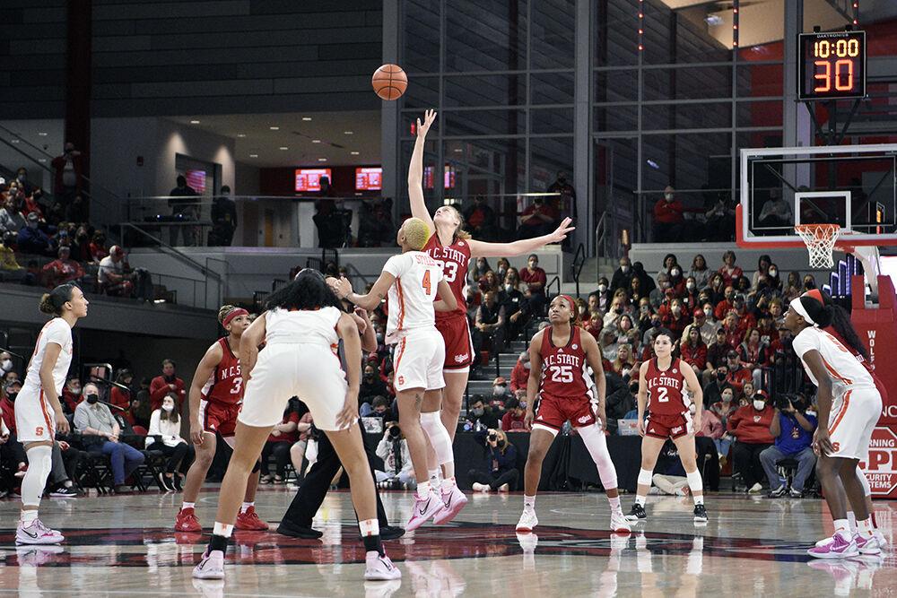 Senior center Elissa Cunane tips off the game against Syracuse on Sunday, Feb. 20, 2022 at Reynolds Coliseum. Cunane scored 14 points during the senior day game. The Wolfpack beat the Orange 95-53.