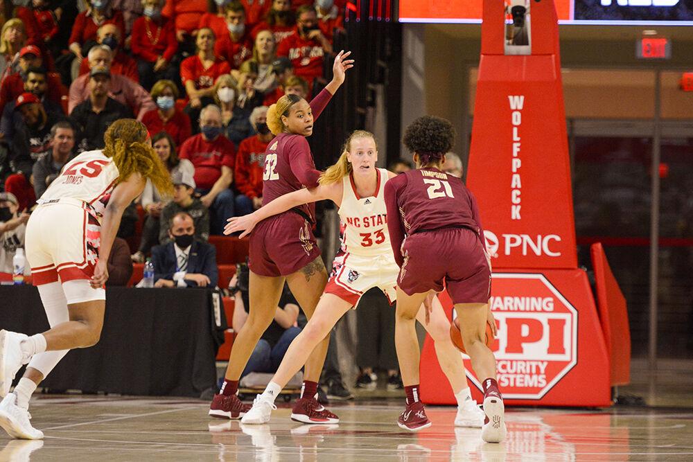 Senior center Elissa Cunane defends the basket in the game against Florida State University in Reynolds Coliseum on Thursday, Feb. 3, 2022. Cunane made six rebounds during the game. The Wolfpack defeated the Seminoles 68-48.