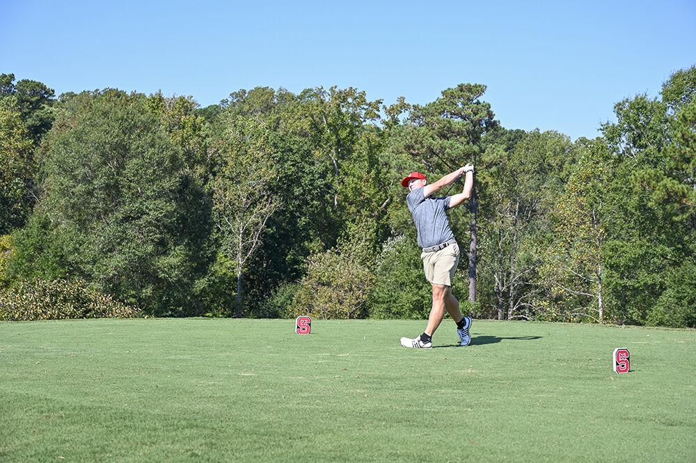 Graduate student Easton Paxton tees off during the Wolfpack Intercollegiate on Oct. 16, 2021 at Lonnie Poole Golf Course. Paxton finished third overall with a score of seven-under. The NC State men's golf team won the tournament with a combined score of 17-under par.&#160;