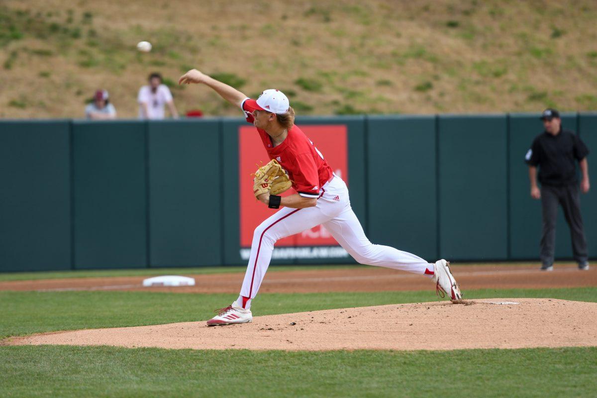 Redshirt sophomore pitcher Logan Whitaker pitches the ball during the game against Longwood on Wednesday, Feb. 23, 2022 at Doak Field. Whitaker pitched five innings during the game. The Wolfpack beat the Lancers 19-3.