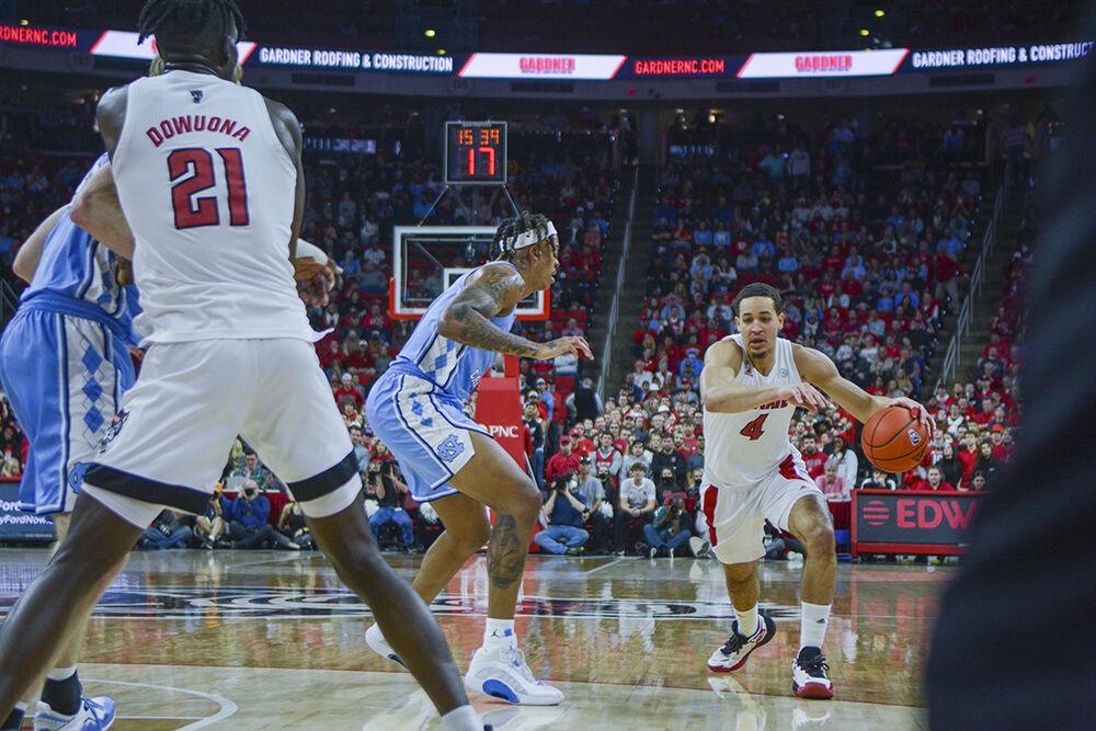 Senior forward Jericole Hellems charges down the court at the men's basketball game against UNC at PNC Arena on Saturday, Feb. 26, 2022. Hellems scored 11 points and three rebounds with the Wolfpack losing to the Tar Heels 84-74.