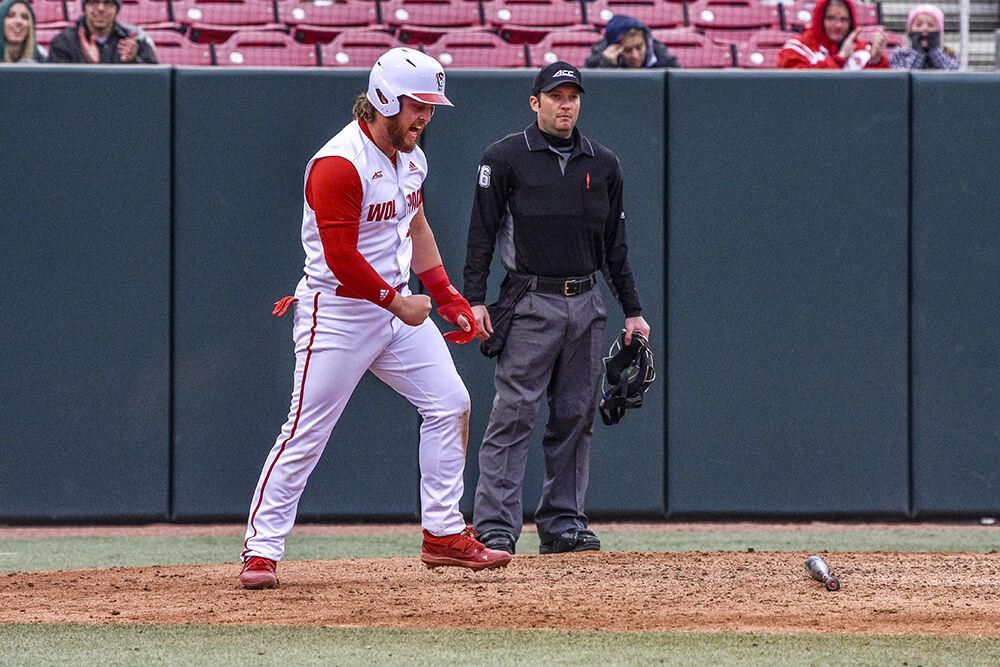 Freshman infielder Tommy White celebrates running home during the Wolfpack's home baseball game against the Quinnipiac Bobcats at Doak Field on Feb. 26, 2022. White had one home run.&#160;The Wolfpack beat the Bobcats 12-10 to win the series.