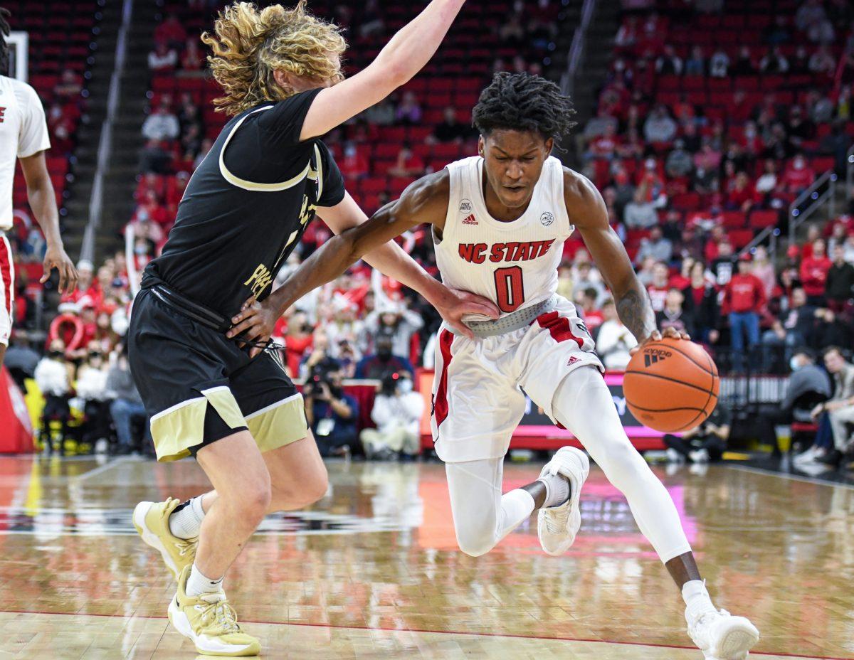 Freshman guard Terquavion Smith battles to bring the ball down the court during the game versus the Wake Forest Demon Deacons on Wednesday, Feb. 9, 2022 in PNC Arena. Smith scored eight points and had four assists against Wake Forest. The Wolfpack lost to the Demon Deacons 69-51.