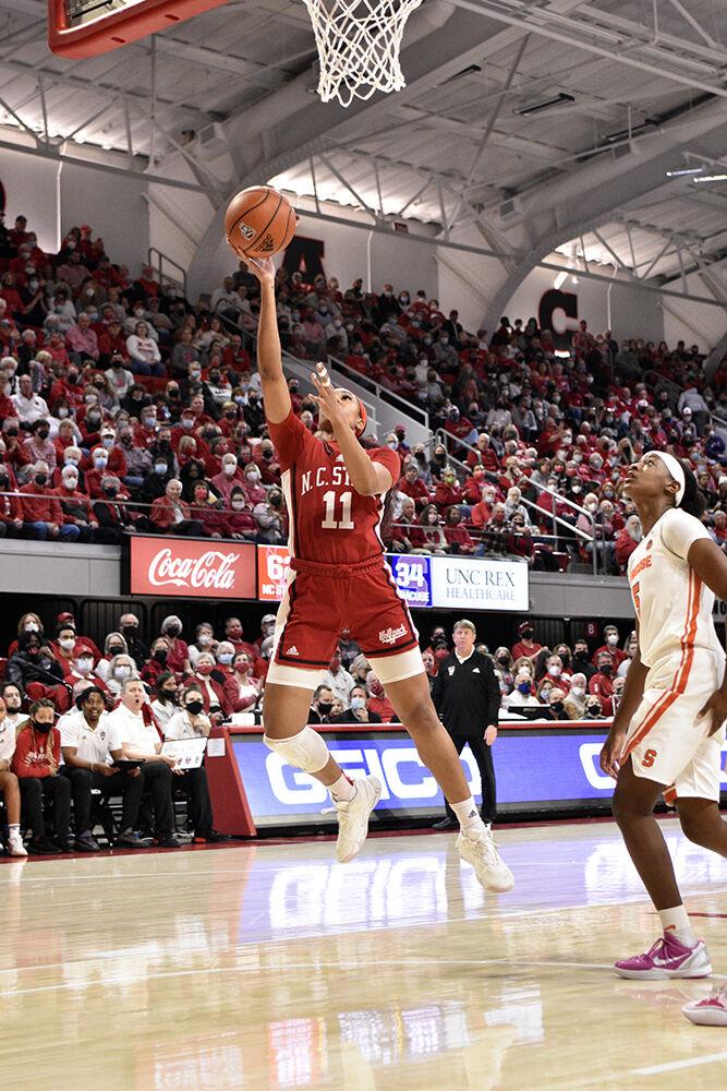 Junior wing Jakia Brown-Turner steals the ball from Syracuse and breaks away for two points on Sunday, Feb. 20, 2022 at Reynolds Coliseum. The Wolfpack won against the Orange 95-53.