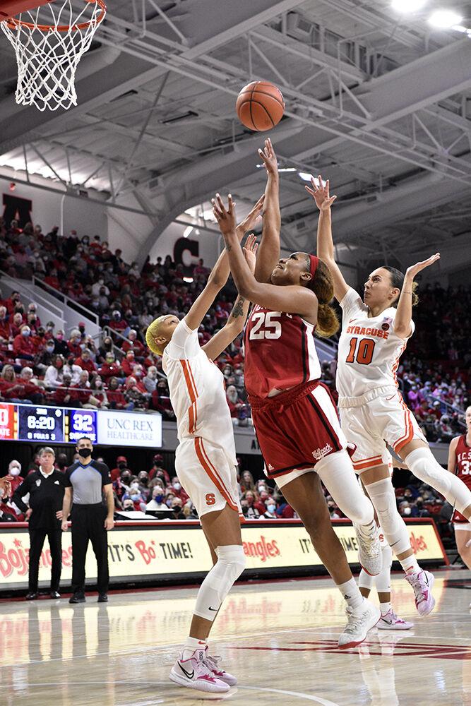 Graduate forward Kayla Jones puts up a layup at the senior day game against Syracuse at Reynolds Coliseum on Sunday, Feb. 20, 2022. Jones had 18 points and three assists. NC State beat Syracuse 95-53.