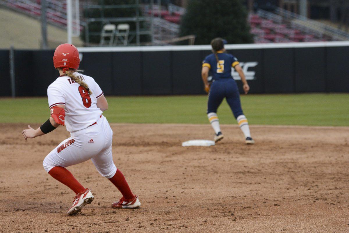 Freshman infielder Michele Tarpey backtracks back to first base during the game against UNCG on Tuesday, Feb. 22, 2022 in Dail Softball Stadium. The Wolfpack beat the Spartans 4-3.
