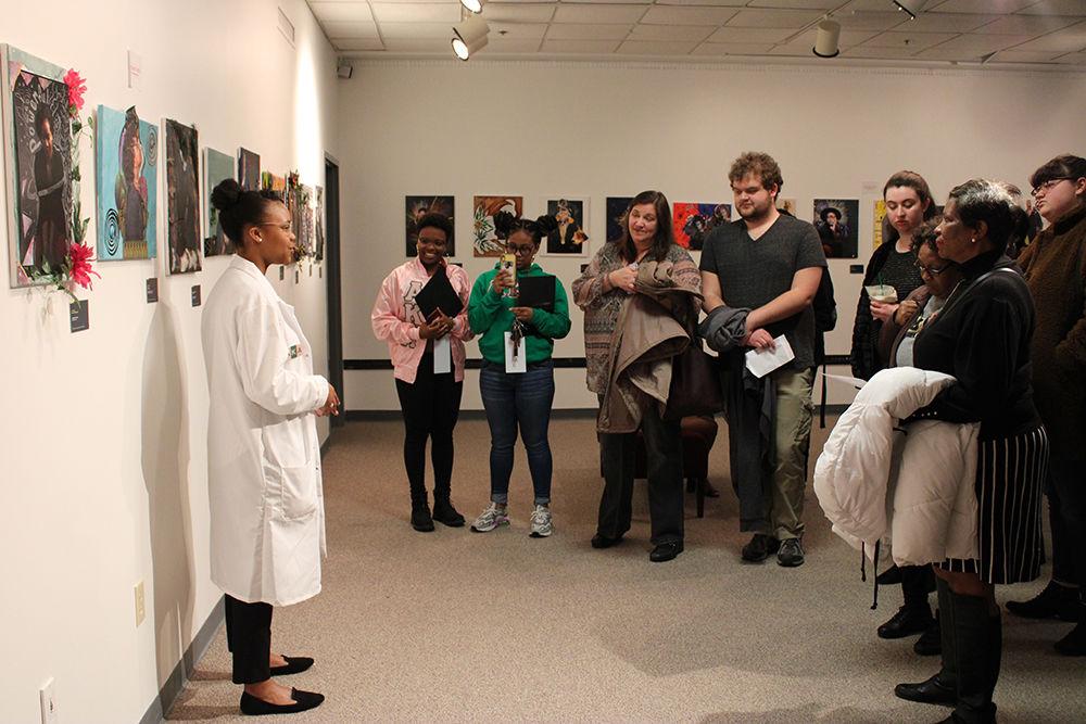 Gwen Hopper, a fourth year studying chemistry, impersonates Patricia Bath at the Blacks in Wax event in Witherspoon Student Center on Saturday, Feb. 22, 2020. Many high school and middle school students toured the event to learn more about black history.