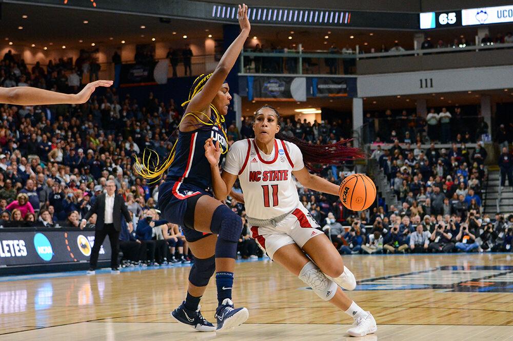 Junior wing Jakia Brown-Turner drives the ball around the block in the Elite 8 game against Connecticut on Monday, March 28, 2022 inside Total Mortgage Arena in Bridgeport, Connecticut. Brown-Turner led in scoring with 20 points for the Wolfpack. NC State lost 91-87 to Connecticut in double overtime.