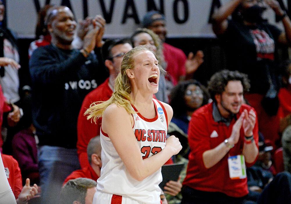 Senior center Elissa Cunane cheers from the bench after a referee call during the second round game of the NCAA tournament against Kansas State. The Wolfpack beat the Wildcats 89-57.