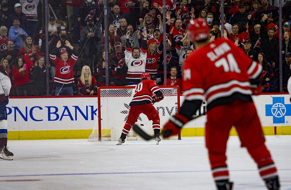 Carolina Hurricanes center Sebastian Aho scores an empty net goal as the crowd celebrates during the game against the Colorado Avalanche on Thursday, March 10, 2022 in PNC Arena. The Hurricanes beat the Avalanche 2-0.