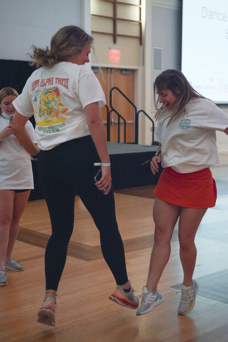 Caitlin Fuller, a second-year in environmental engineering, dances with Annalise Wolf, a third-year in physics, in Talley Student Union during Dance Marathon on Saturday, March 5, 2022. This event is a fundraiser for Duke Children's Hospital where participants dance to raise money.