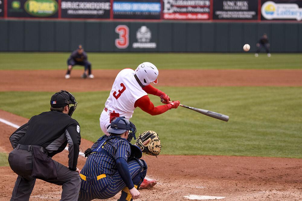Senior center fielder Devonte Brown hits the ball during the game against Quinnipiac on Saturday, Feb. 26, 2022 in Doak Field at Dail Park. The Wolfpack beat the Bobcats 12-10 to win the series.