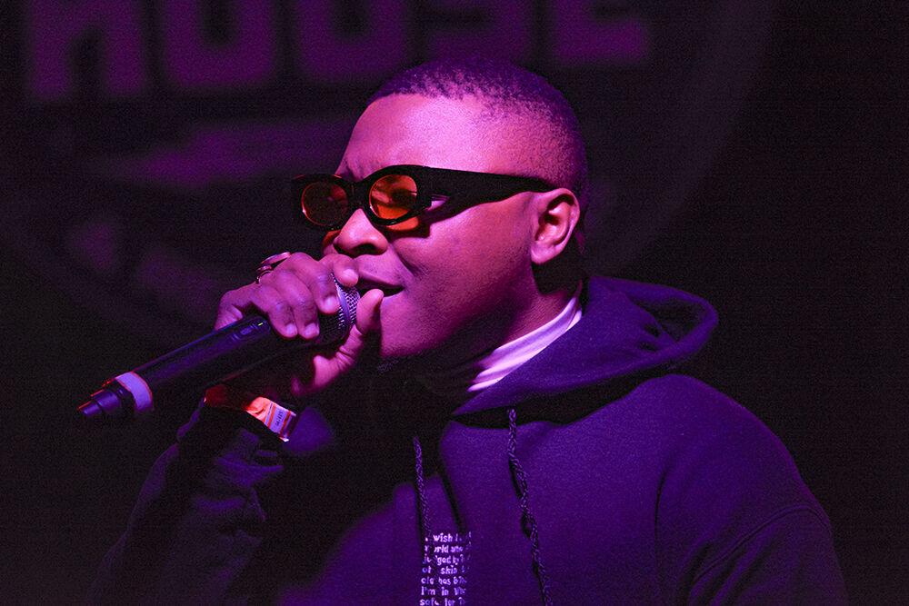 Elijah Rosario sings his music into the microphone during the 18th annual Double Barrel Benefit hosted by WKNC at the Pour House Music Hall in Raleigh on March 12, 2022. The Double Barrel Benefit is a fundraiser that accounts for 6%&#160;of WKNC&#8217;s annual income.