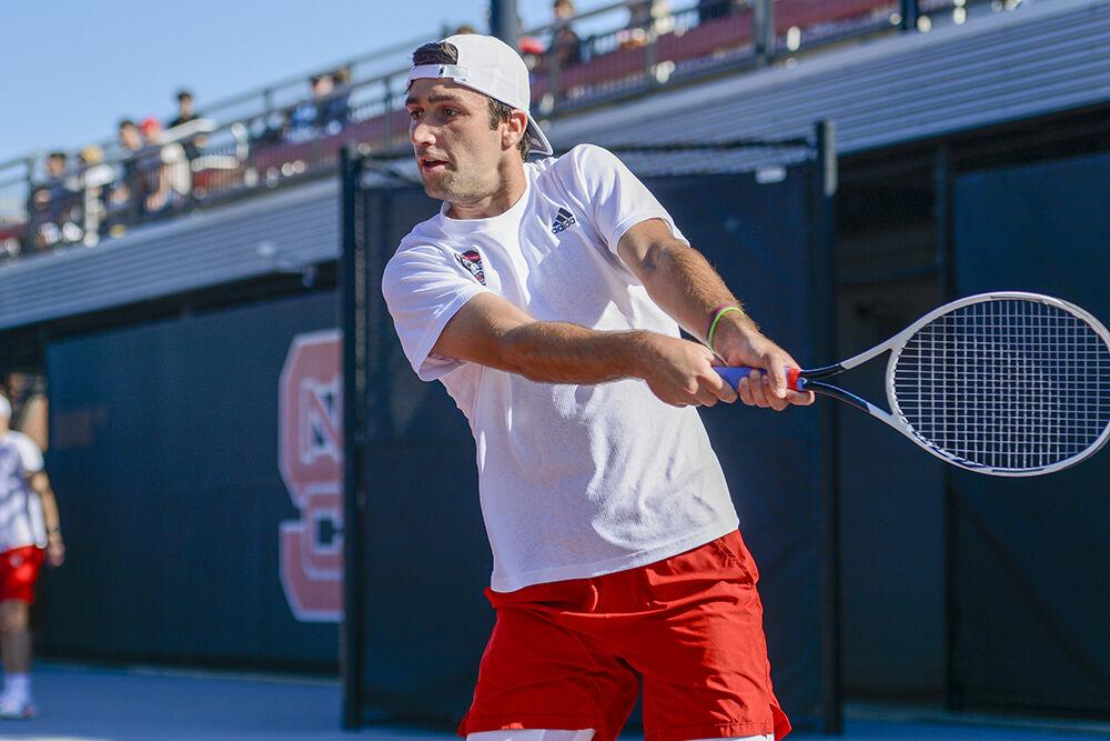 Senior Rafa Izquierdo Luque prepares to hit the ball during his singles match against Northwestern on Monday, March 21, 2022 at the J.W. Isenhour Tennis Center. Izquierdo Luque won his singles match with NC State beating Northeastern 4-2.