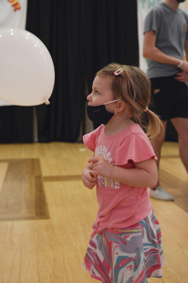 Caylyn Brienzi, a sister of a cancer survivor, plays with volunteers in Talley Student Union during the Dance Marathon on Saturday, March 5, 2022. This event is a fundraiser for Duke Children's Hospital where participants dance to raise money.