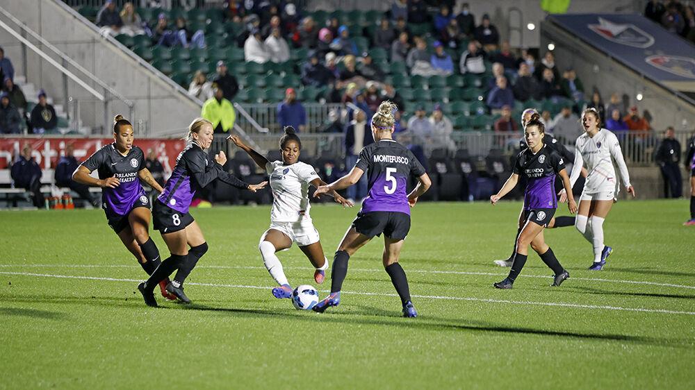 NC Courage midfielder Brianna Pinto prepares to kick the ball to a teammate during the preseason match against Orlando Pride on Saturday, March 26, 2022 in Sahlen&#8217;s Stadium at WakeMed Soccer Park. NC Courage beat Orlando Pride 1-0.