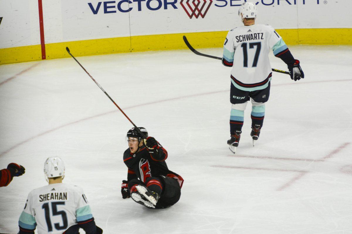 Carolina Hurricanes center Martin Necas watches his shot go into the goal as he lays on the ice during the game against the Seattle Kraken on Sunday, March 6, 2022 in PNC Arena. Necas had one goal on the evening and was named the first star after the game. The Hurricanes beat the Kraken 3-2.