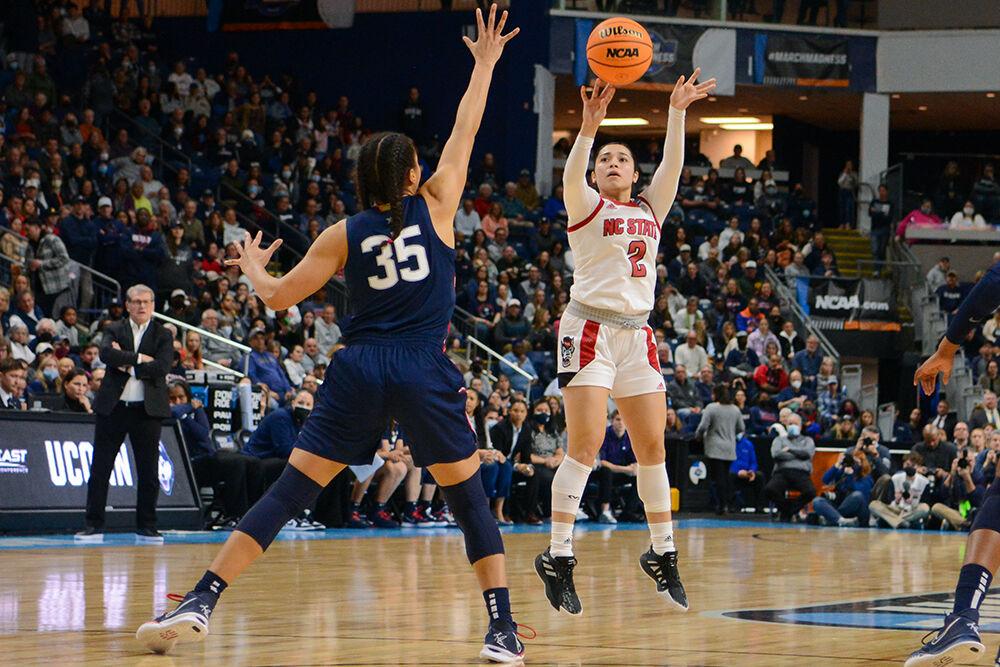 Graduate student guard Raina Perez shoots the ball over the block in the Elite 8 game against Connecticut on Monday, March 28, 2022 inside Total Mortgage Arena in Bridgeport, Connecticut. Perez contributed four rebounds for the Wolfpack. NC State lost 91-87 to Connecticut in double overtime.