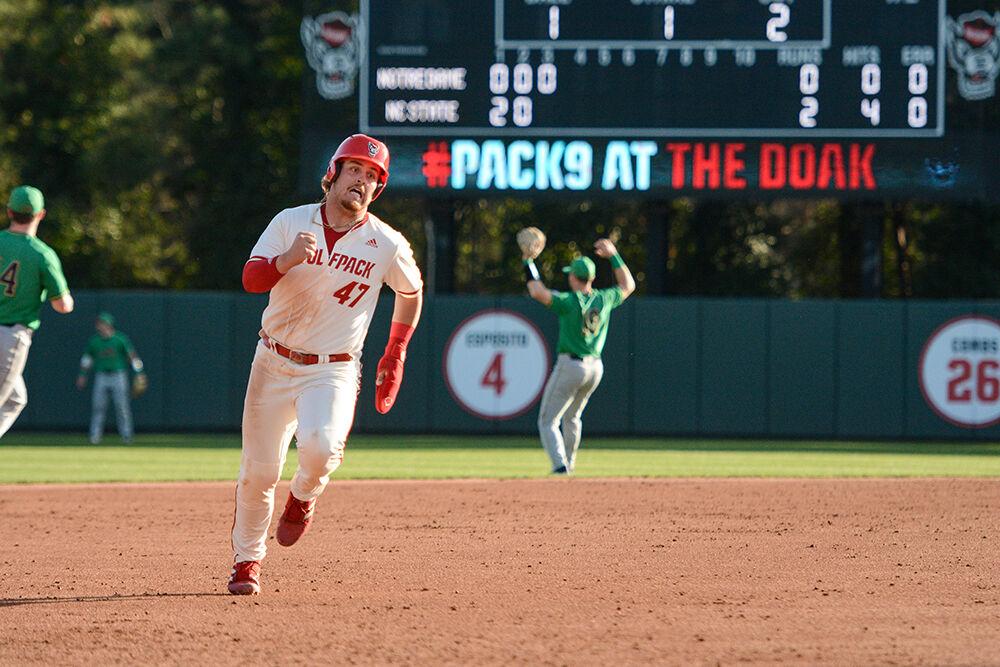 Freshman infielder Tommy White rounds second base during the Wolfpack's home baseball game against the Notre Dame Fighting Irish at Doak Field on March 11, 2022. The Wolfpack lost the opening game of the home series 8-4 in 12 innings.