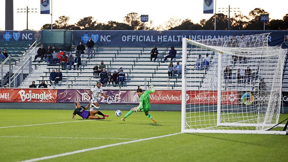 NC Courage defender Taylor Smith takes a shot on the goal against Orlando Pride on Saturday, March 26, 2022 in Sahlen&#8217;s Stadium at WakeMed Soccer Park. NC Courage beat Orlando Pride 1-0.