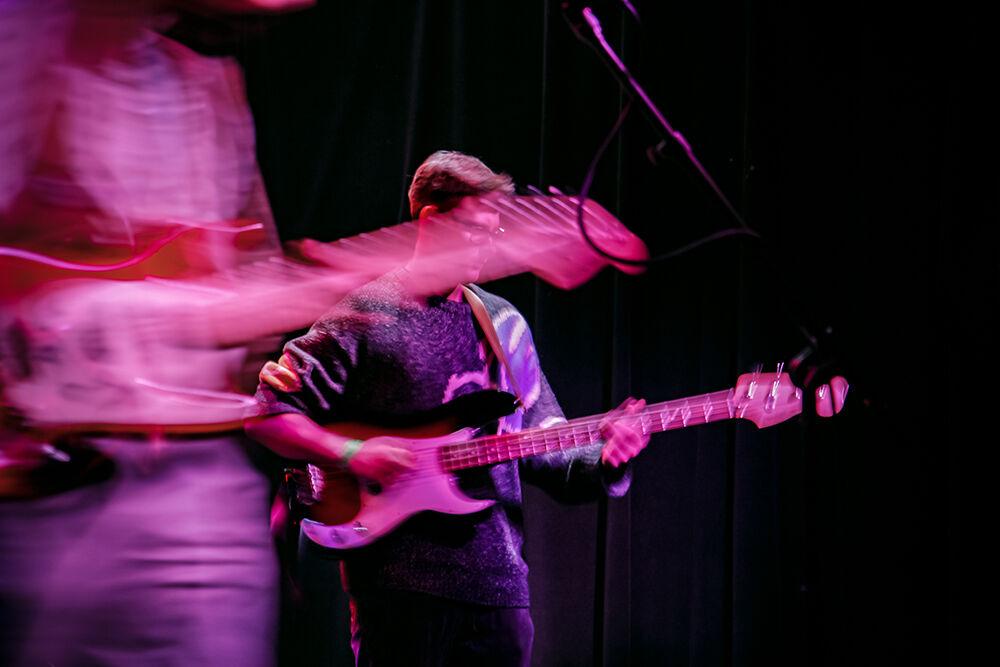 Holden Edwards plays the base with the Kenny Wavinson band during the 18th annual Double Barrel Benefit hosted by WKNC at the Pour House Music Hall in Raleigh on March 12, 2022. This event was the first time the Kenny Wavinson band performed on stage together.