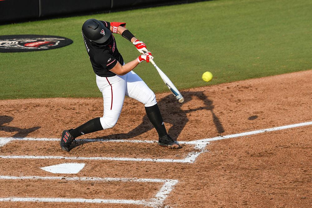 Redshirt sophomore infielder Libby Whittaker connects with the pitch during the game versus the Campbell Camels on Tuesday, March 22, 2022 in Dail Softball Stadium. Whittaker had one hit against Campbell. The Wolfpack beat the Camels 2-0.