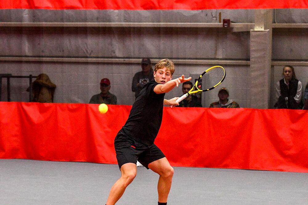 Freshman Fons Van Sambeek prepares to make a forehand swing in his singles match against Boston College player Juan Jose Bianchi on Sunday, Feb. 27, 2022 at J.W. Isenhour Tennis Center. Van Sambeek won both singles matches with scores of 6-0 and 6-1, respectively. The Wolfpack won the match 7-0.