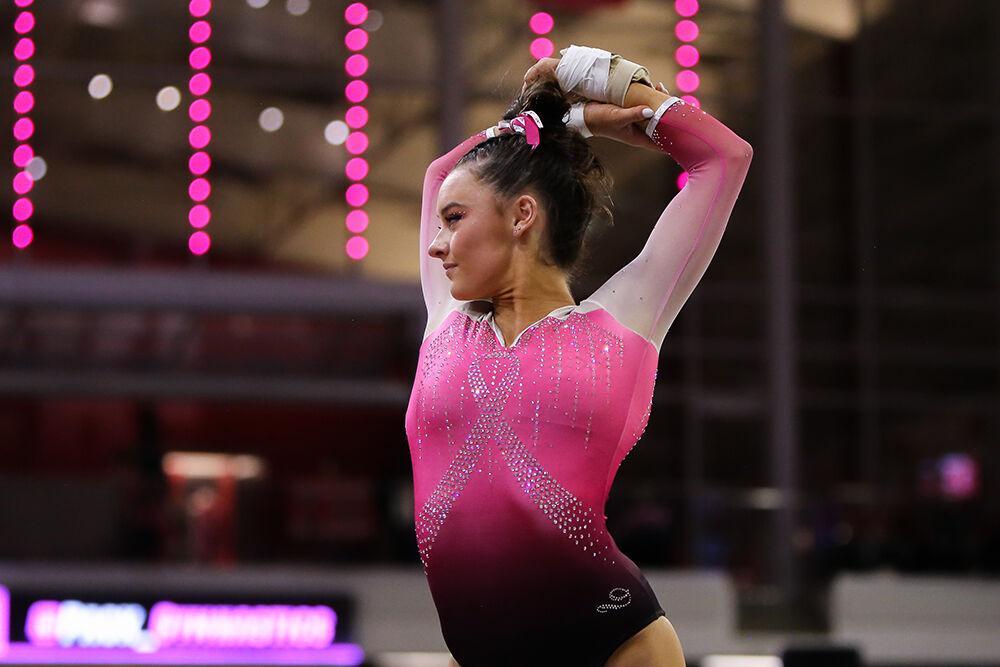 Junior Emily Shepard performs on the floor during the Pink Meet against Temple in Reynolds Coliseum on Friday, Feb. 25, 2022. NC State lost 196.675-196.600.