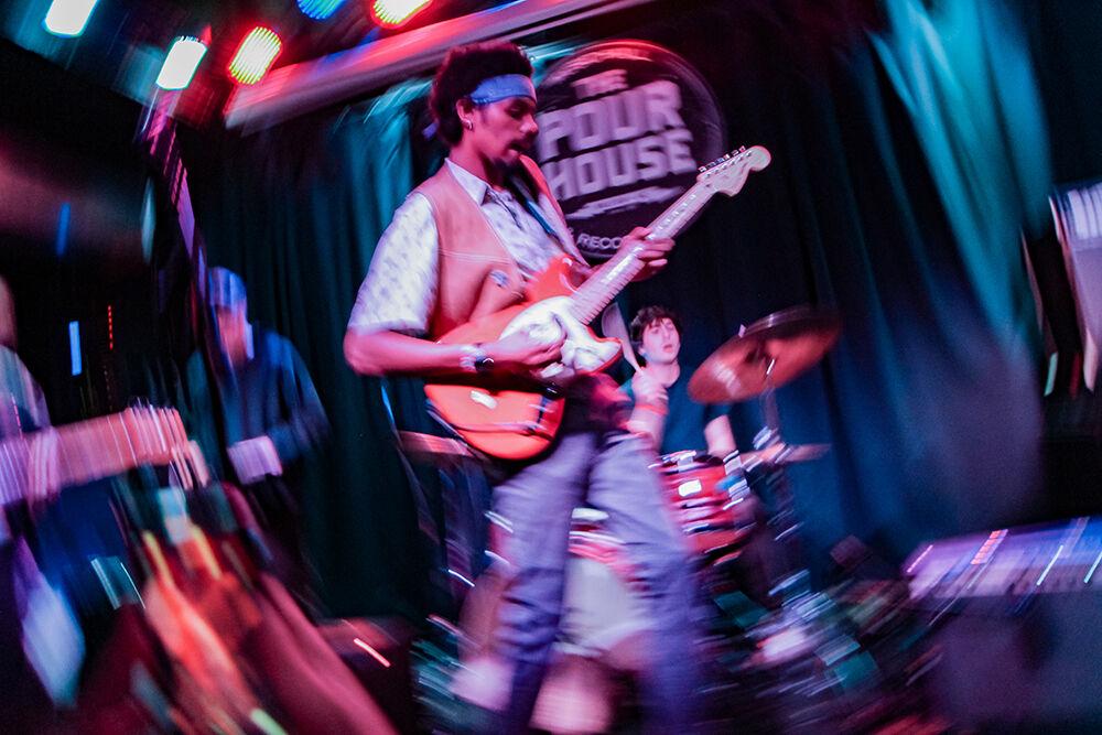 Kenny Wavinson sings into the microphone during the 18th annual Double Barrel Benefit hosted by WKNC at the Pour House Music Hall &amp; Record Shop in Raleigh on March 12, 2022. This event was the first time his band performed on stage together.