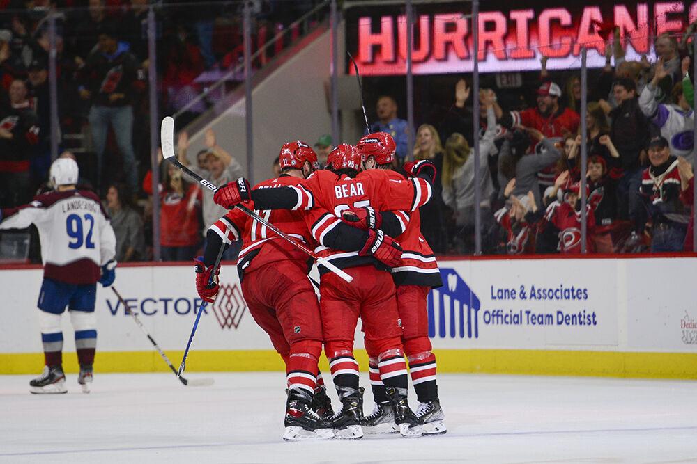Carolina Hurricanes defenseman Ethan Bear Celebrates a tie breaking goal with teammates Jordan Staal and Jesper Fast during the game against the Colorado Avalanche on Thursday, March 10, 2022 in PNC Arena. Bear had one goal and four shots on the night. The Hurricanes shut out the Avalanche 2-0.