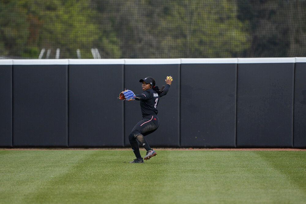 Graduate student Brittany Jackson throws during the game against UNC-Charlotte on Wednesday, March 30, 2022 at Dail Softball Stadium. Jackson hit a homerun during the Wolfpack's 9-4 win over the 49ers.