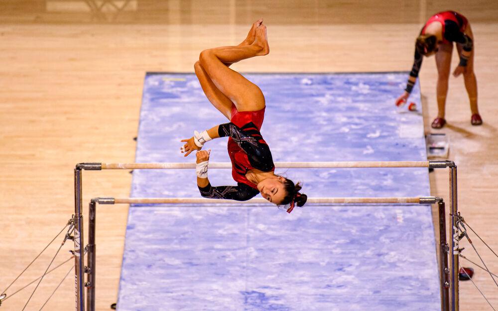 Sophomore Emily Shepard performs on the uneven bars on Saturday, March 13, 2021 at Reynolds Coliseum. Shepard scored a 9.900 in the event. The Wolfpack beat Long Island University with a team score of 196.900.