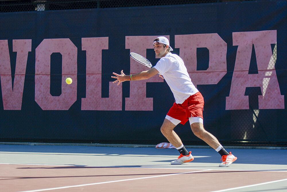 NC State senior Rafa Izquierdo Luque readies himself to return a hit during the tennis match against Northwestern on Monday, March 21, 2022 in J.W Isenhour Tennis Center. The Wolfpack beat the Wildcats 4-2.