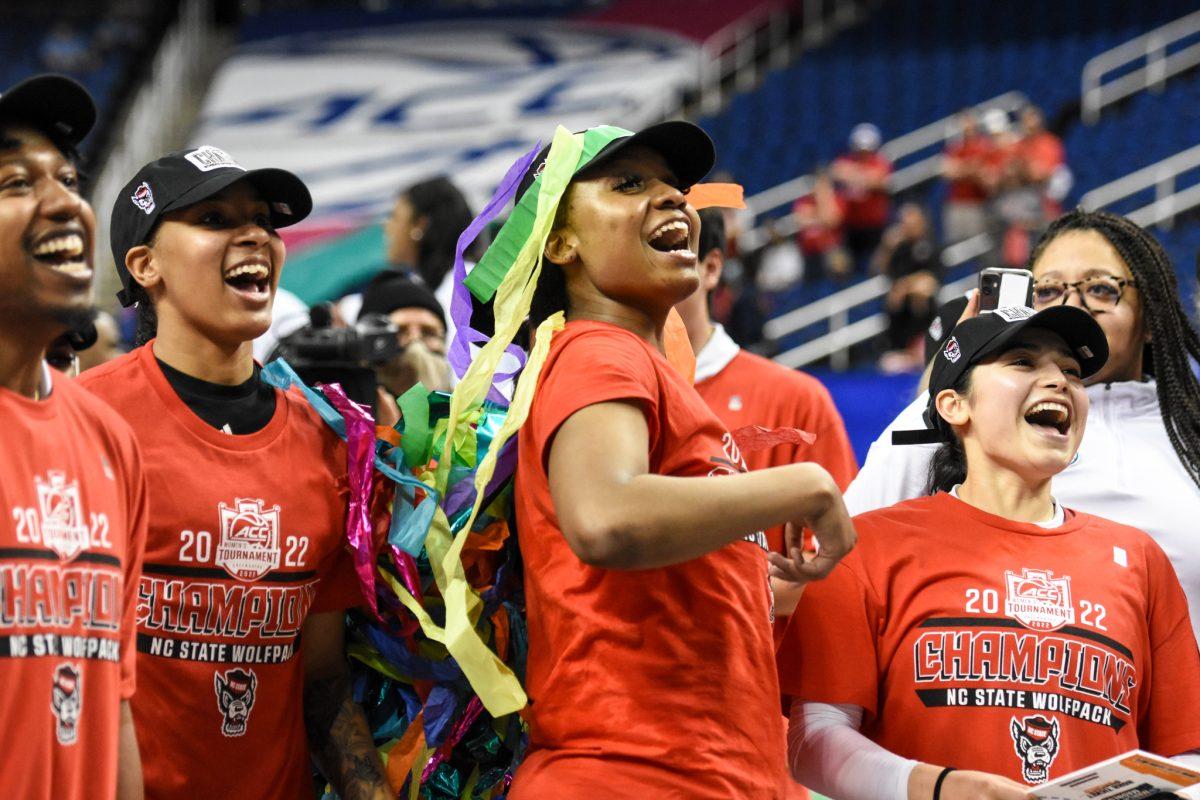 The NC State Women's Basketball team celebrate their ACC Tournament championship victory over the Miami Hurricanes on Sunday, March 6, 2022 in the Greensboro Coliseum. The Wolfpack beat the Hurricanes 60-47.