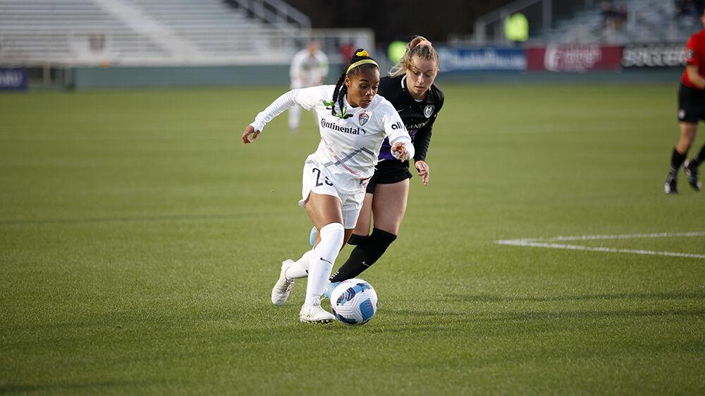 NC Courage defender Kiki Pickett moves the ball away from an Orlando Pride defender during the preseason match on Saturday, March 26, 2022 in Sahlen&#8217;s Stadium at WakeMed Soccer Park. NC Courage beat Orlando Pride 1-0.