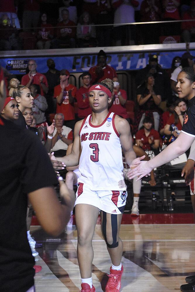 Graduate guard Kai Crutchfield walks on the court after her name is announced in the starting lineup during the second round of the NCAA tournament against Kansas State on Monday, March 21, 2022 at Reynolds Coliseum. Crutchfield scored five points and had two rebounds during the game. NC State beat Kansas State 89-57 and advanced to the Sweet 16.