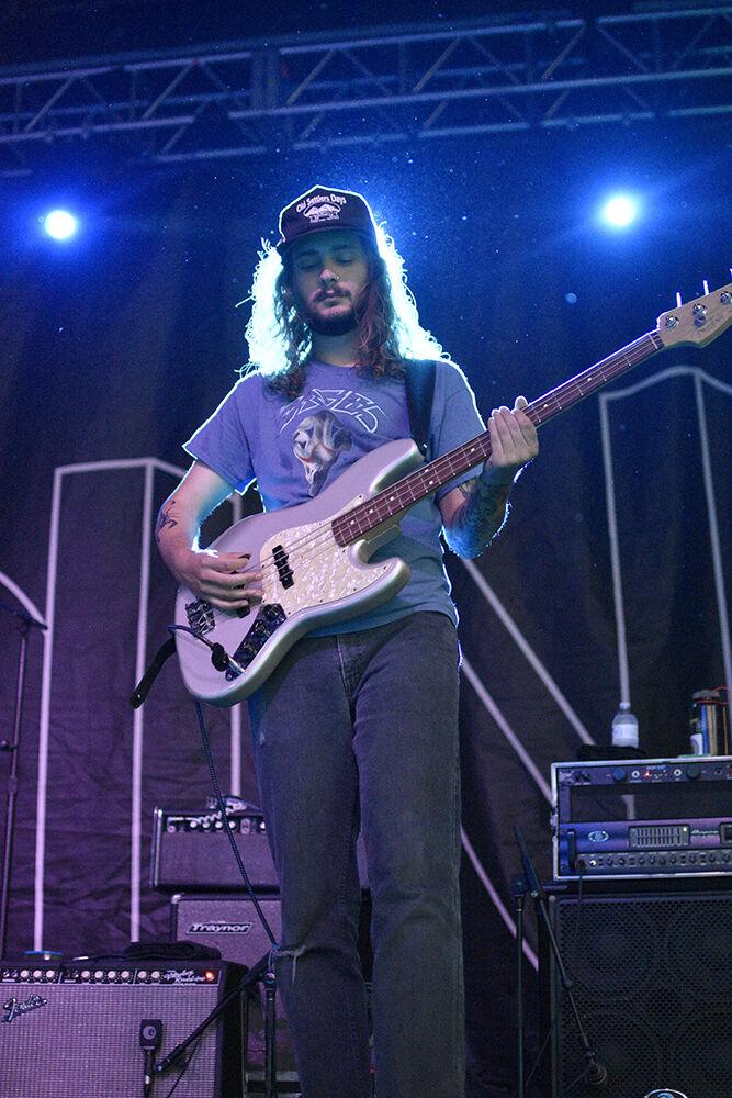 KJ Ward, the bass guitarist for The Backseat Lovers, plays during their set at Wolfstock on Monday, April 25, 2022 at Stafford Commons. The Backseat Lovers were the second in the lineup during the concert, preceded by the band By George and followed by COIN.