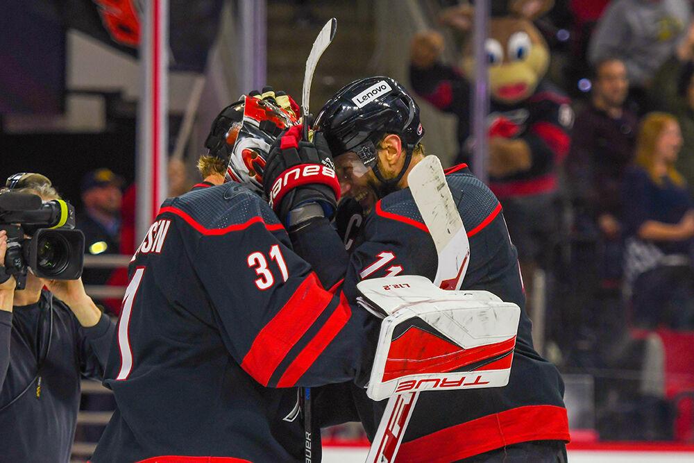 Carolina Hurricanes goalie Frederik Andersen and center Jordan Staal celebrate a win together just after the game against the Anaheim Ducks on Sunday, April 10, 2022 in PNC Arena. Andersen saved 23 of 25 shots, and Staal came away with his first hat trick since 2012. The Hurricanes beat the Ducks 5-2.