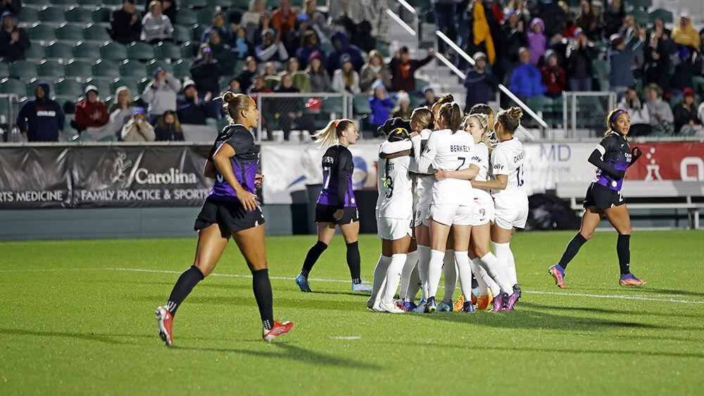 NC Courage celebrates after a goal from a penalty kick against Orlando Pride in Sahlen&#8217;s Stadium at WakeMed Soccer Park on Saturday, March 26, 2022. NC Courage defender Merritt Mathias kicked the penalty kick in the second half of the game. NC Courage beat Orlando Pride 1-0.