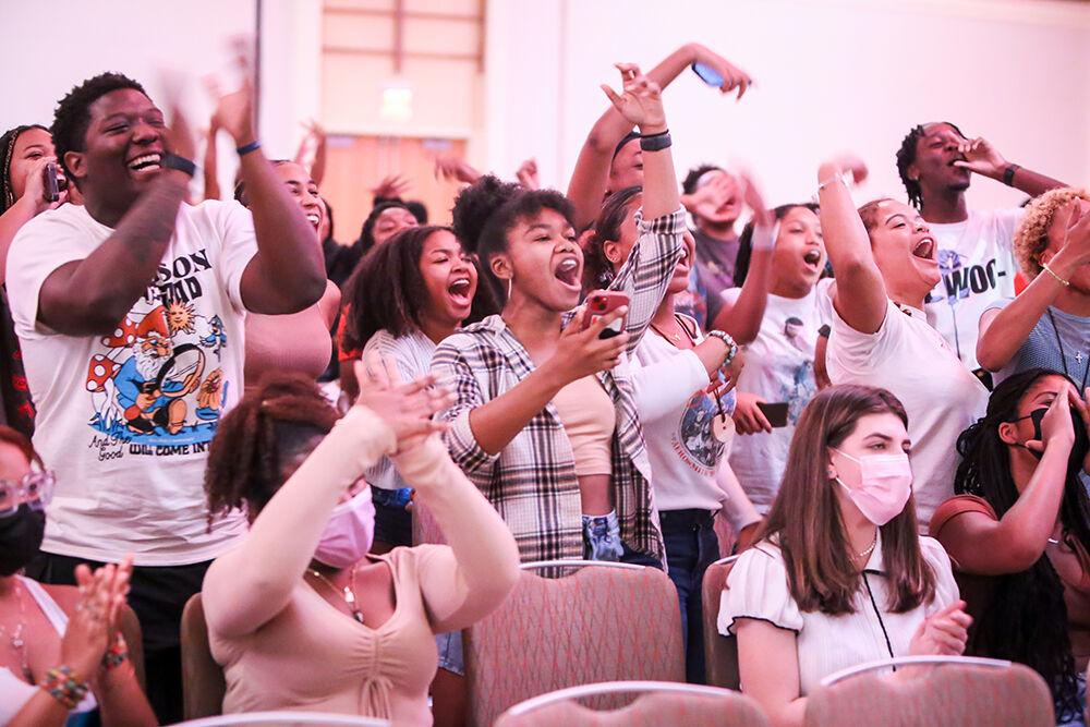 The crowd of students cheer on two students competing in an impromptu dance competition during Pan-Afrikan Week's Black Out Loud Comedy Show in Talley Student Center on Wednesday, Apr. 6, 2022.