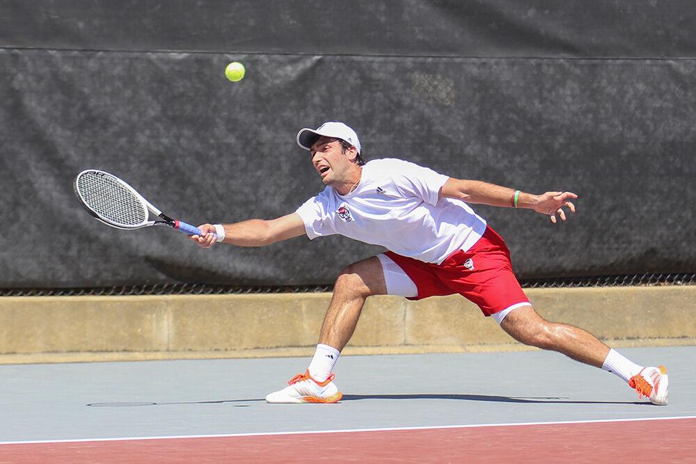 Senior Rafa Izquierdo Luque lunges to return the ball to his UNC-Chapel Hill opponent on Sunday, April 17, 2022 at J.W. Isenhour Tennis Center. The Wolfpack lost to the Tarheels 4-3.