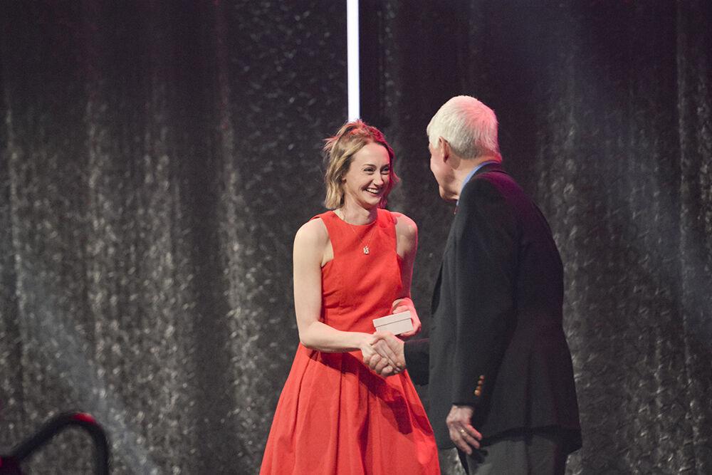 Sophie Ketron, a third-year in communication, shakes Dr. Tom Stafford's hand during the Ring Ceremony in Reynolds Coliseum on Wednesday, April 27, 2022. The Alumni Association held the ceremony for all the students and alumni who have completed 60 or more undergraduate credits or studied in a master's or doctoral program.