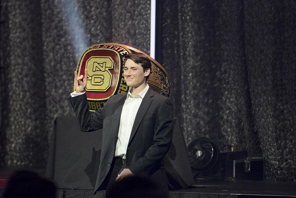 Ransom Smith, a third-year in business administration, poses for his photo in front of the ring during the Ring Ceremony in Reynolds Coliseum on Wednesday, April 27, 2022. The Alumni Association held the ceremony for all the students and alumni who have completed 60 or more undergraduate credits or studied in a master's or doctoral program.