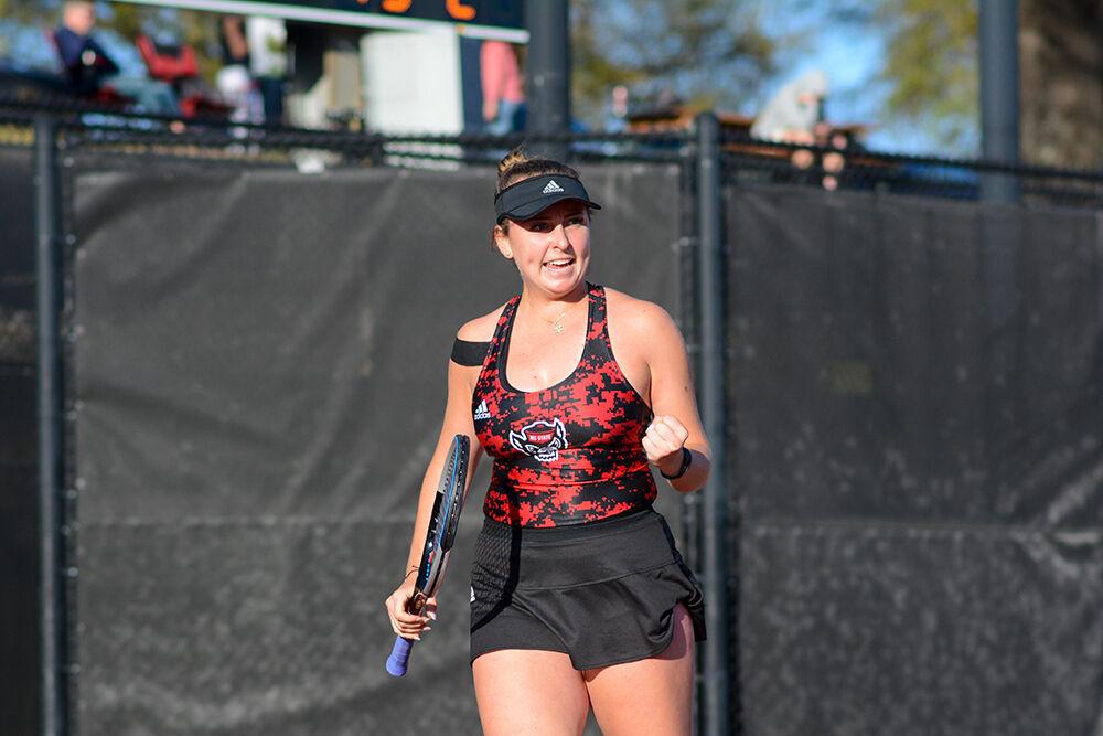 Sophomore Abigail Rencheli celebrates a point during the match against Duke at Dail Outdoor Tennis Stadium on Friday, April 1, 2022. The Wolfpack lost to the Blue Devils&#160;4-3.