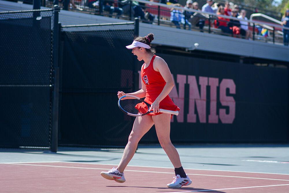 Senior Nell Miller celebrates a point during the match against UNC-Chapel Hill on Sunday, April 3, 2022 at Dail Outdoor Tennis Stadium. The Wolfpack lost to the Tar Heels 4-3.