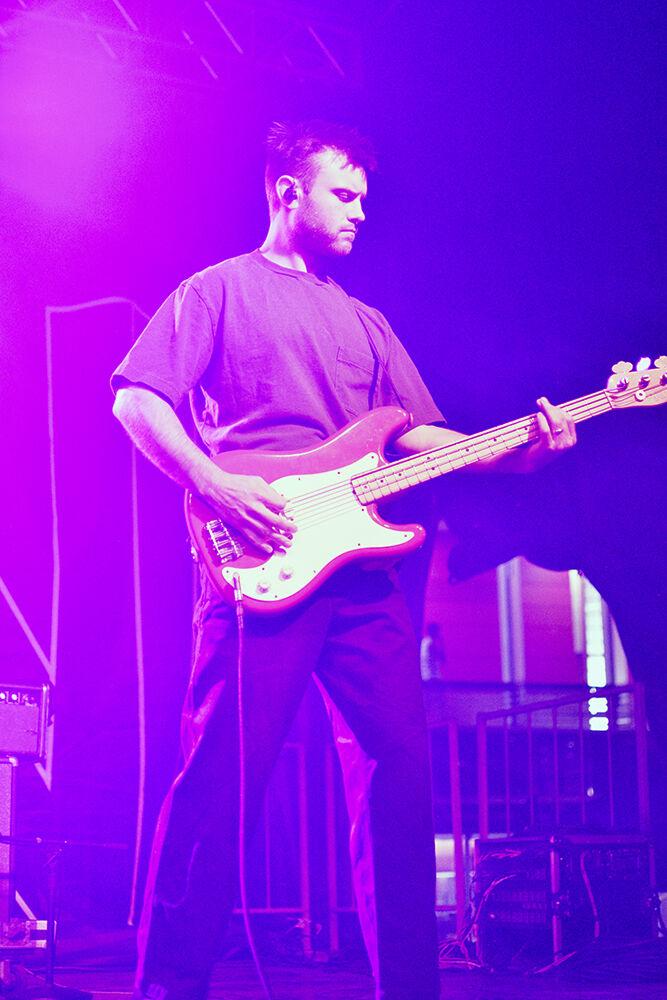 Matt Martin, a bassist for COIN, plays for the crowd at Wolfstock held at Stafford Commons on Monday, April 25, 2022. Wolfstock, an all day event and concert, was held on the last day of classes for NC State students.