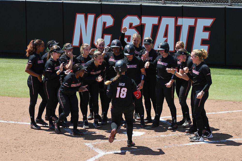 Fifth year catcher Sam Sack runs to join the rest of her team after hitting a home run in the game against Norfolk State on Wednesday, April 27, 2022 in Dail Softball Stadium. Sack was the only player to hit a home run for the Wolfpack. NC State won the game 4-1.