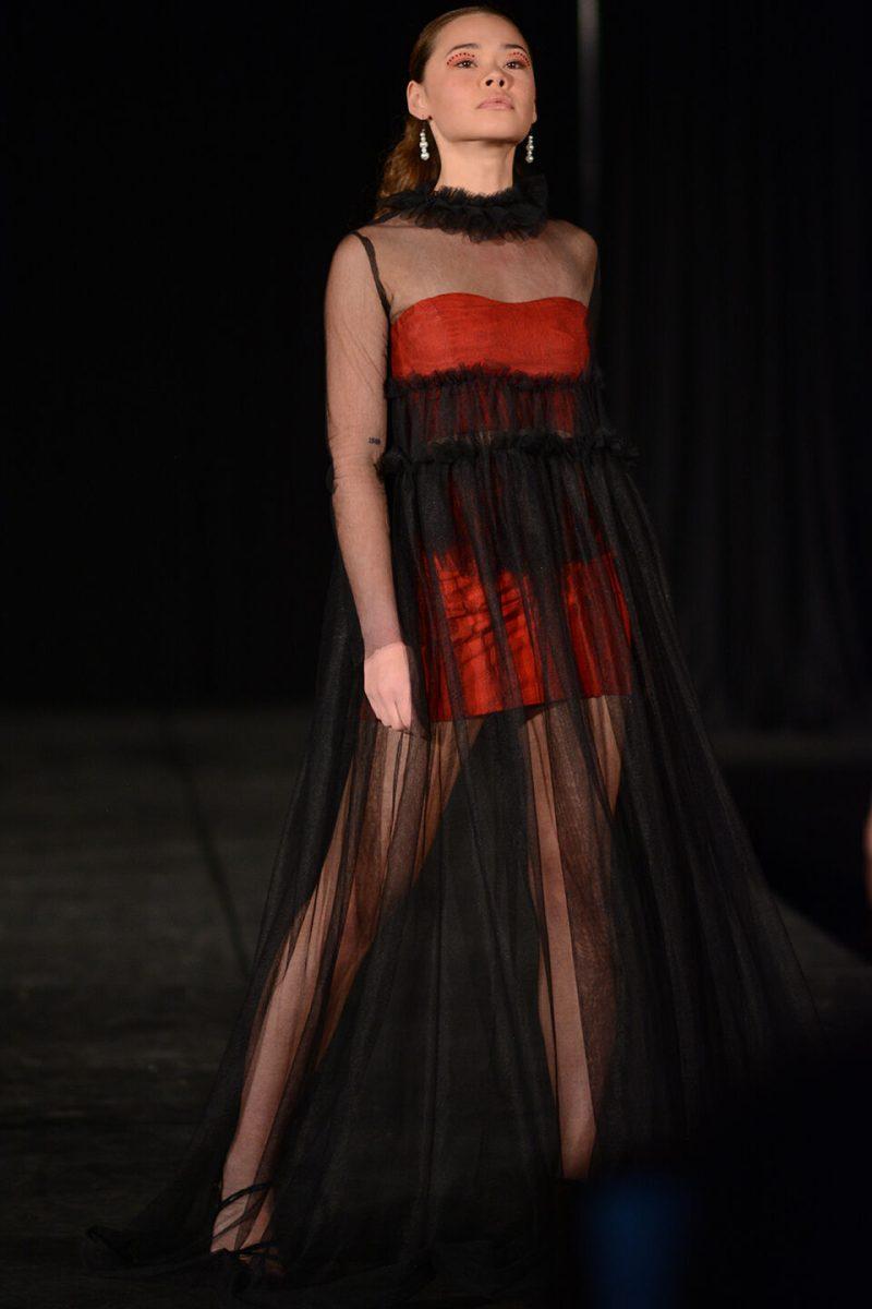 A model showing off designer Natalia Barnack's collection poses at the end of the runway on Thursday, April 7, 2022 at the African American Textile Society's 24th Annual Fashion Expos&#233; in Talley State Ballroom. Three designers participated in the &#8220;Novice&#8221; division, which was for designers with fewer than two years of experience, and four designers participated in the Intermediate and Beyond division.
